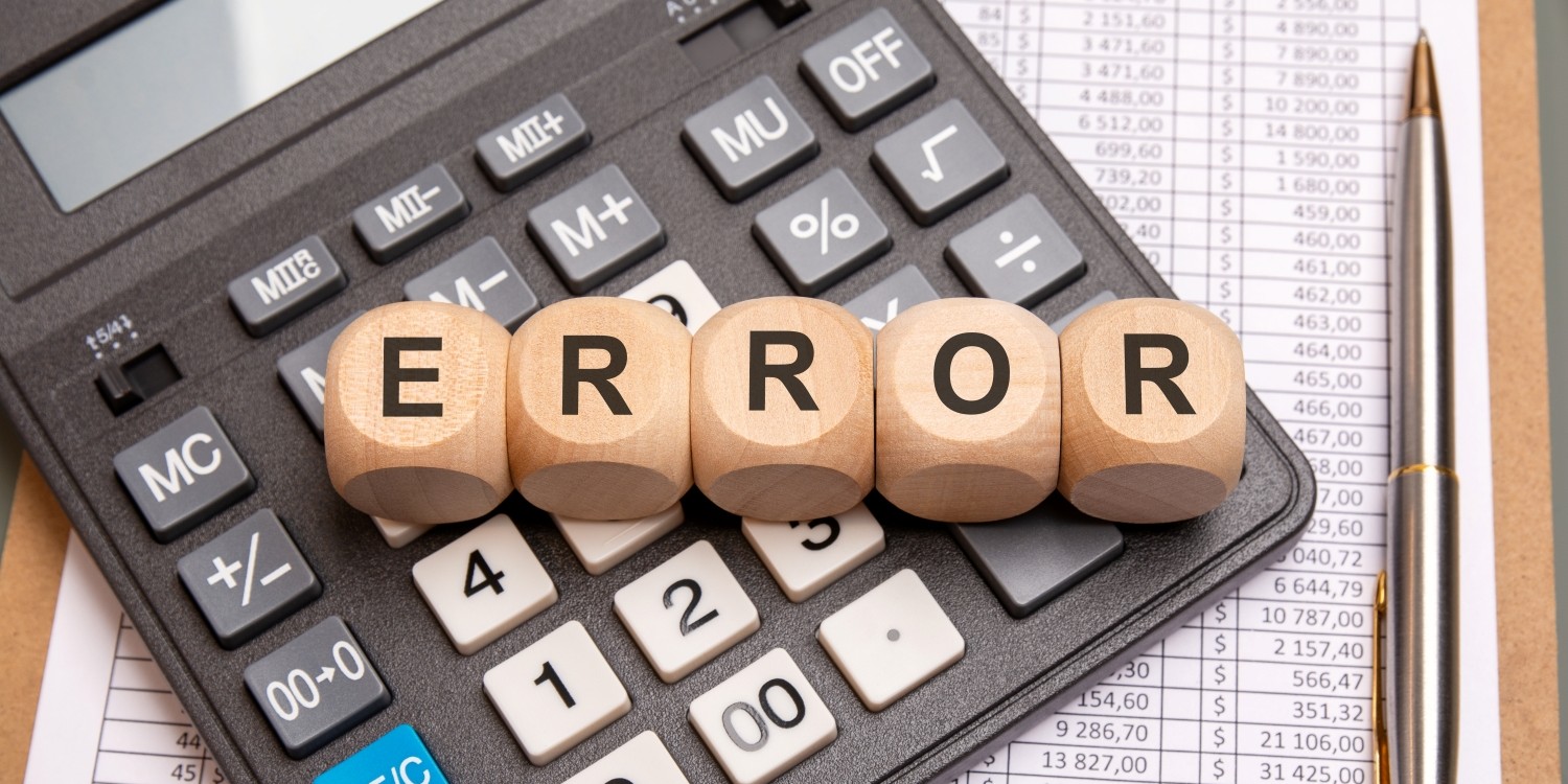 A calculator with tiles on top that spell out "ERROR"