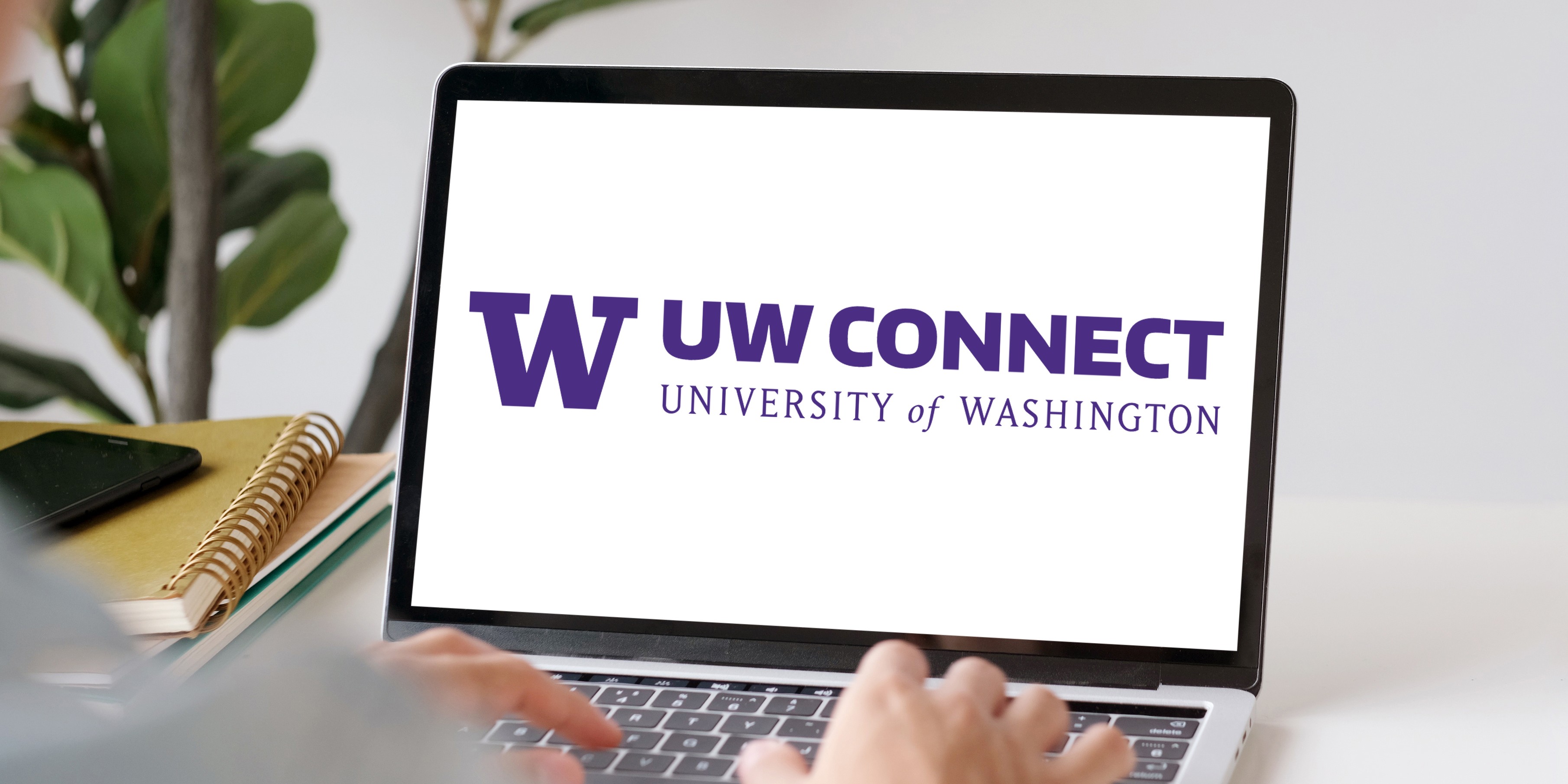 A laptop with the UW Connect logo on the screen